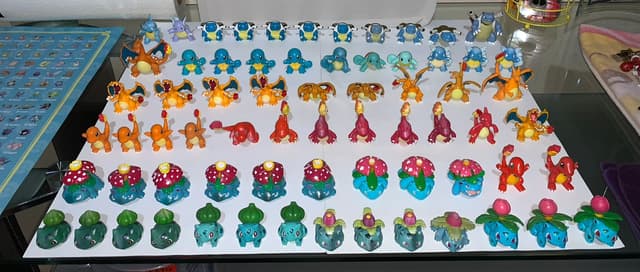 Charmander, Charmeleon, Charizard, Squirtle +5 · Monster Collection · many pose/color variants incl. Mega Charizard