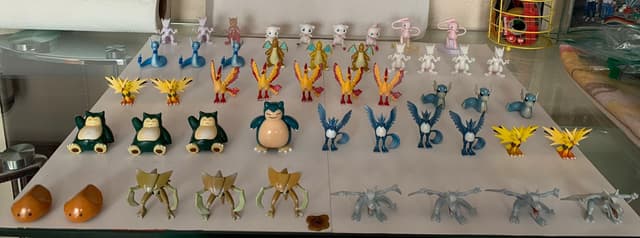 Mewtwo, Mew, Dragonair, Dragonite +8 · Monster Collection · one tan/alt-color Snorlax variant
