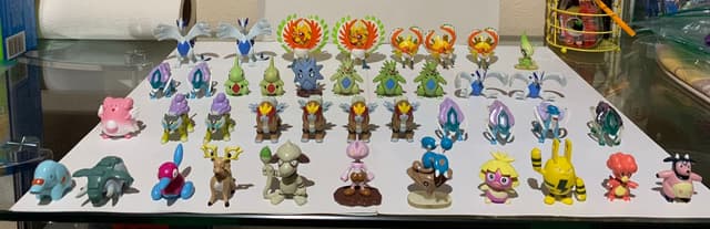 Lugia, Ho-Oh, Celebi, Suicune +13 · Monster Collection · silver/pearl Lugia variants present